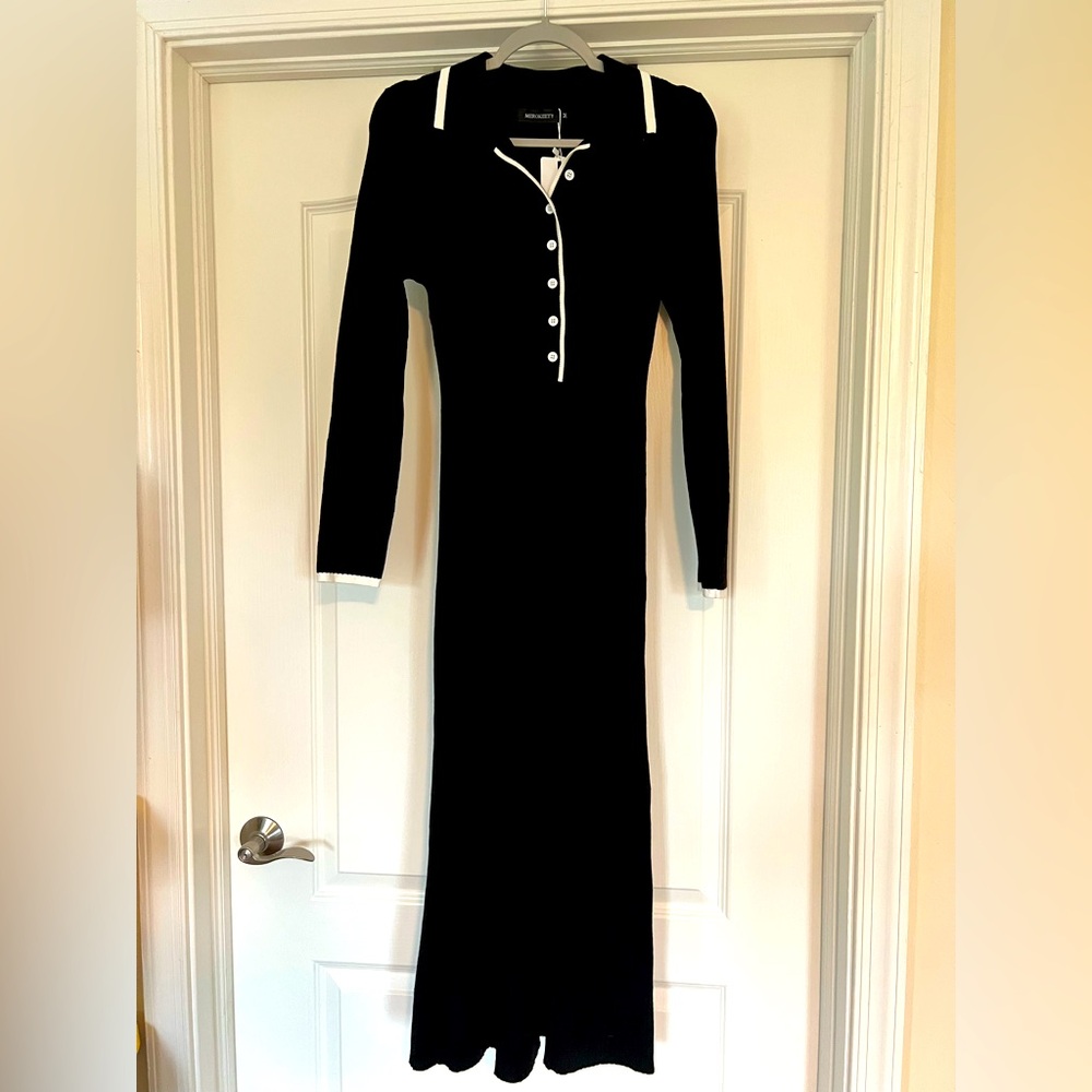 Black tea length dress. Reminds me of Wednesday Adams.